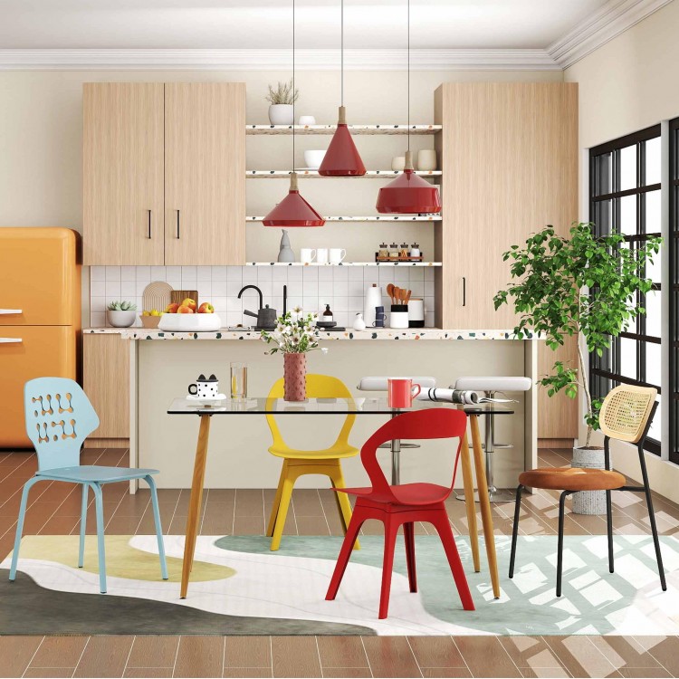 Modern dining set featuring a glass table and colorful chairs in a stylish kitchen setting for versatile dining.