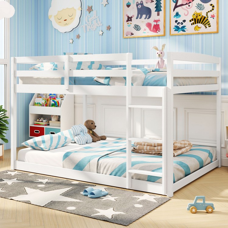 Full over full low-to-ground bunk bed in white with guardrails and integrated ladder, perfect for kids' bedrooms.