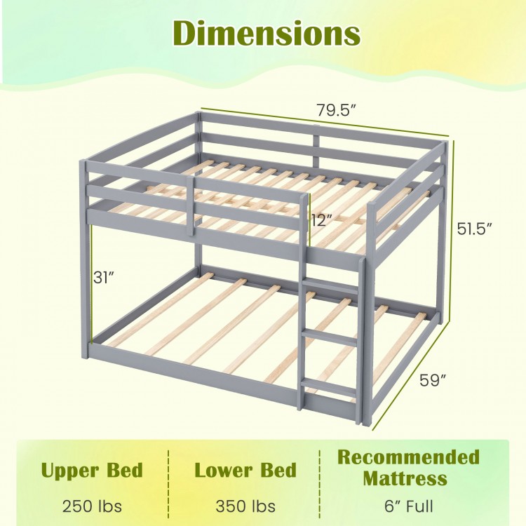 Full over full low-to-ground bunk bed in gray, featuring solid wood frame and safety guardrails, ideal for kids' rooms.