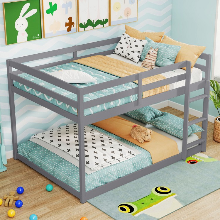 Gray full over full low-to-ground bunk bed with guardrails and integrated ladder, ideal for kids' rooms.