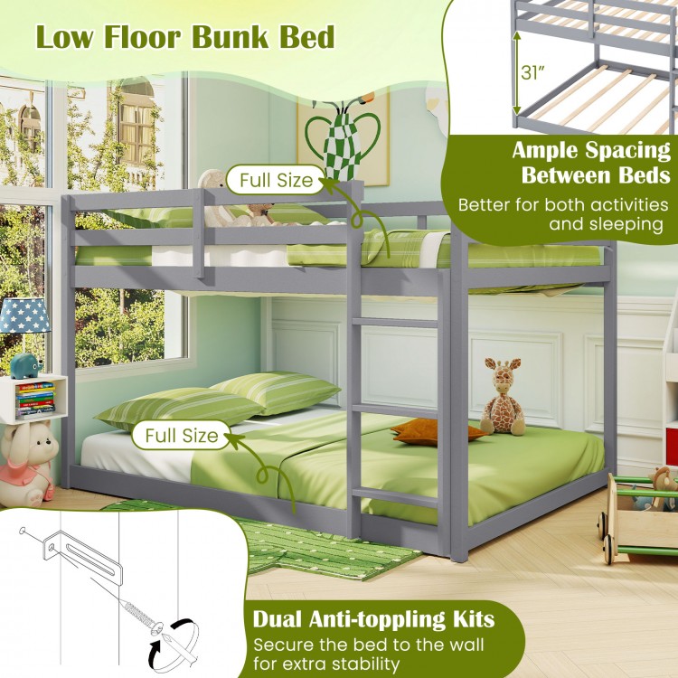 Low floor full over full bunk bed in gray with ample spacing, guardrails, and integrated ladder for kids' safety.