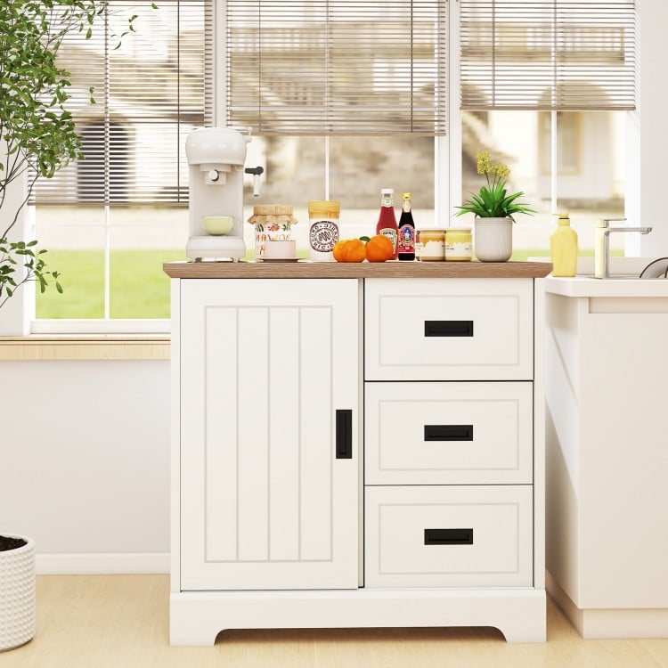 Farmhouse sideboard buffet cabinet in white with sliding doors, featuring three drawers for organized kitchen storage.