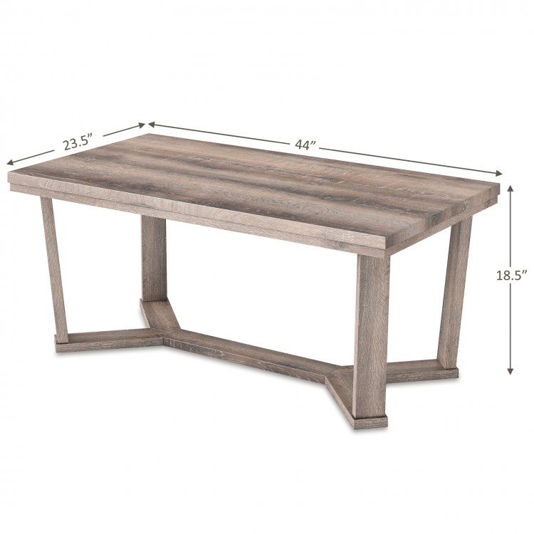 Gray rectangle coffee table with a cross-shaped base, showcasing rounded corners and dimensions of 44” L x 23.5” W x.
