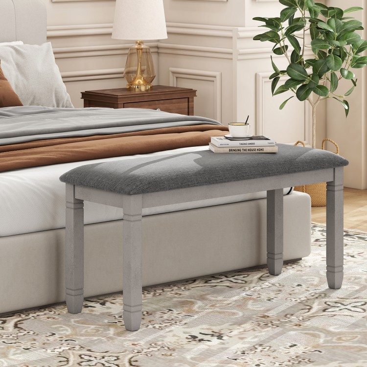 Upholstered gray bedroom bench with padded seat and solid wood legs, perfect for stylish seating and storage.