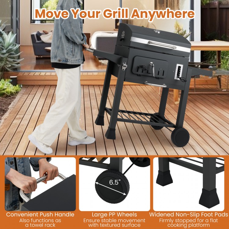 24-inch barrel charcoal grill with folding side tables, large wheels, and push handle for easy mobility and.