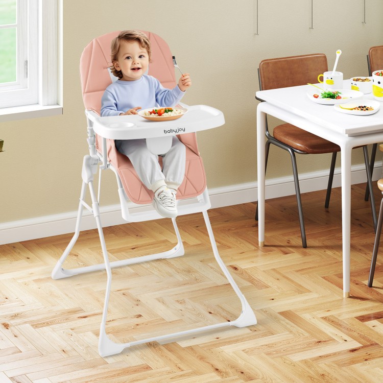 Compact pink highchair with adjustable tray and footrest, designed for easy cleaning and child safety in dining spaces.