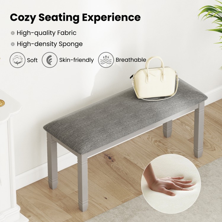 Upholstered gray bedroom bench with padded seat and solid wood legs, perfect for cozy seating in any room.