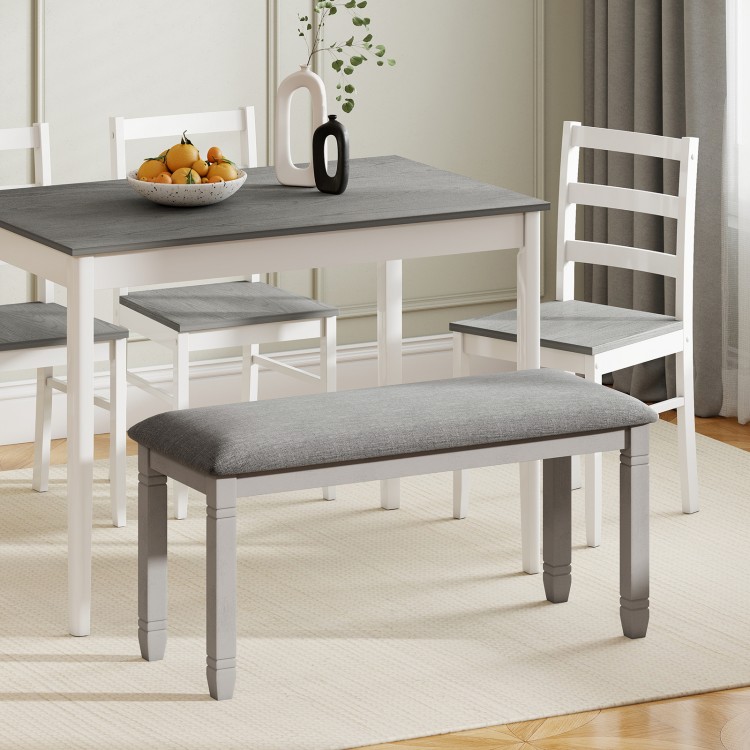 Upholstered gray bench with padded seat and solid wood legs, perfect for dining rooms or entryways.
