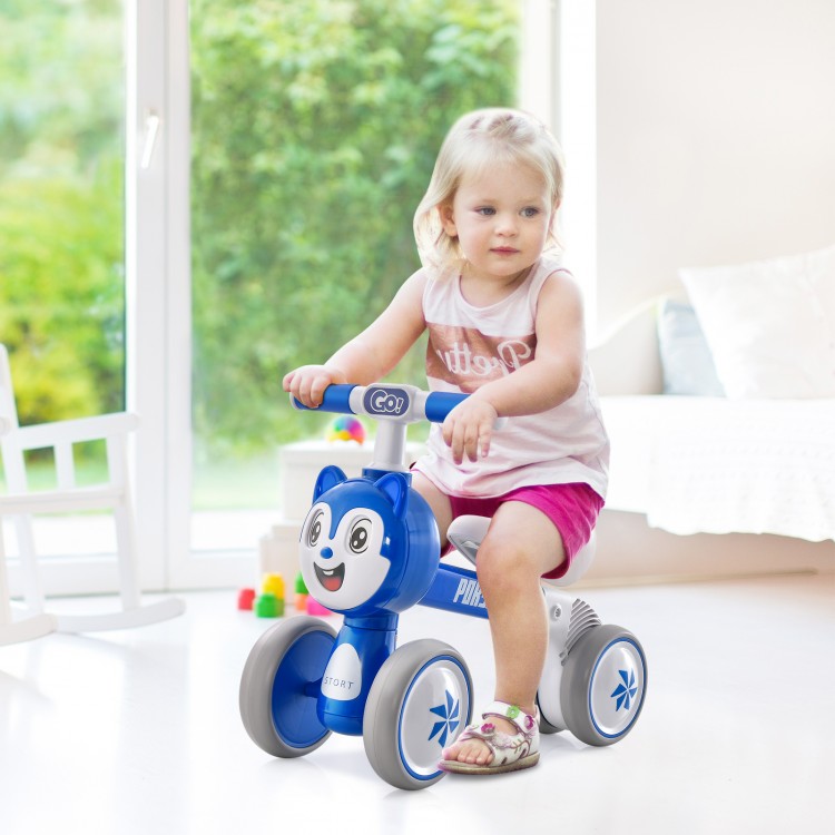 Blue baby balance bike with four wheels, featuring a sturdy frame and comfortable seat for safe, fun riding.