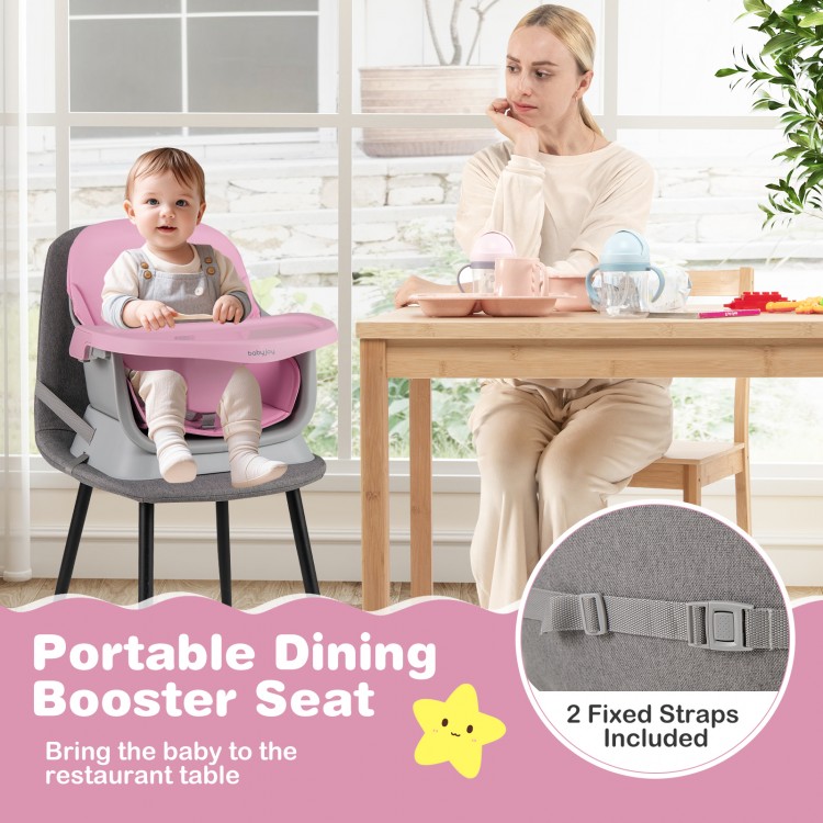 Portable pink baby booster seat with adjustable straps, ideal for dining at the table with toddlers and babies.