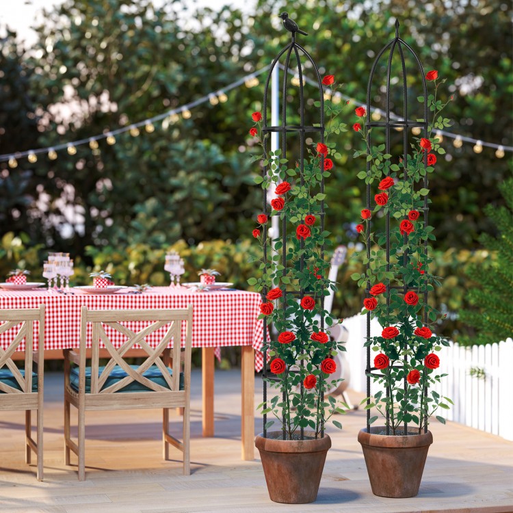 Two black garden obelisk trellises with climbing red roses, ideal for supporting various plants in outdoor settings.