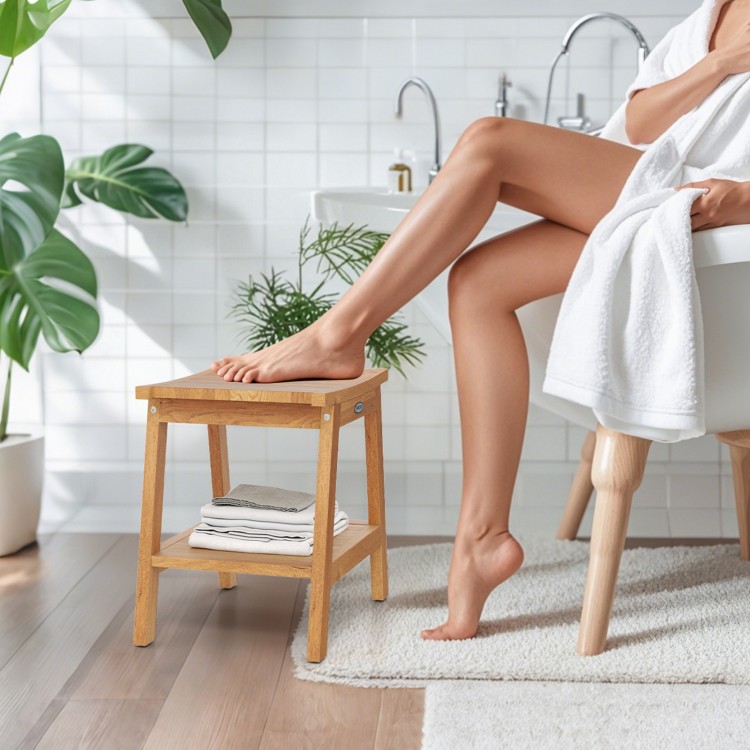 Teak wood shower bench with storage shelf, curved seat design, adjustable foot pads, ideal for bathroom use.