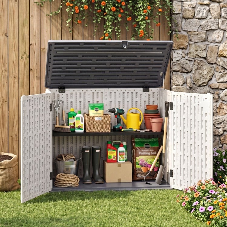 Horizontal resin storage shed with adjustable shelf, ideal for garden tools and accessories, shown with open doors.