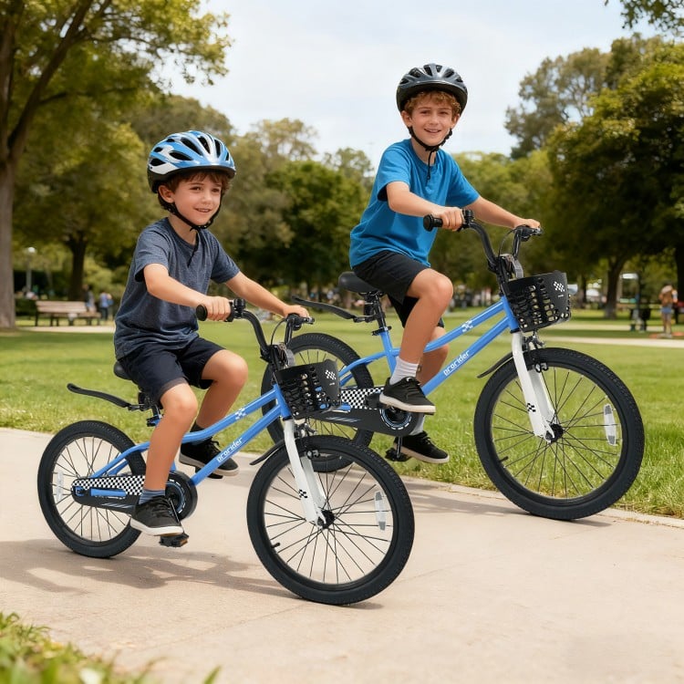 Two kids riding a 20-inch navy bike with adjustable features, kickstand, and storage basket in a park setting.