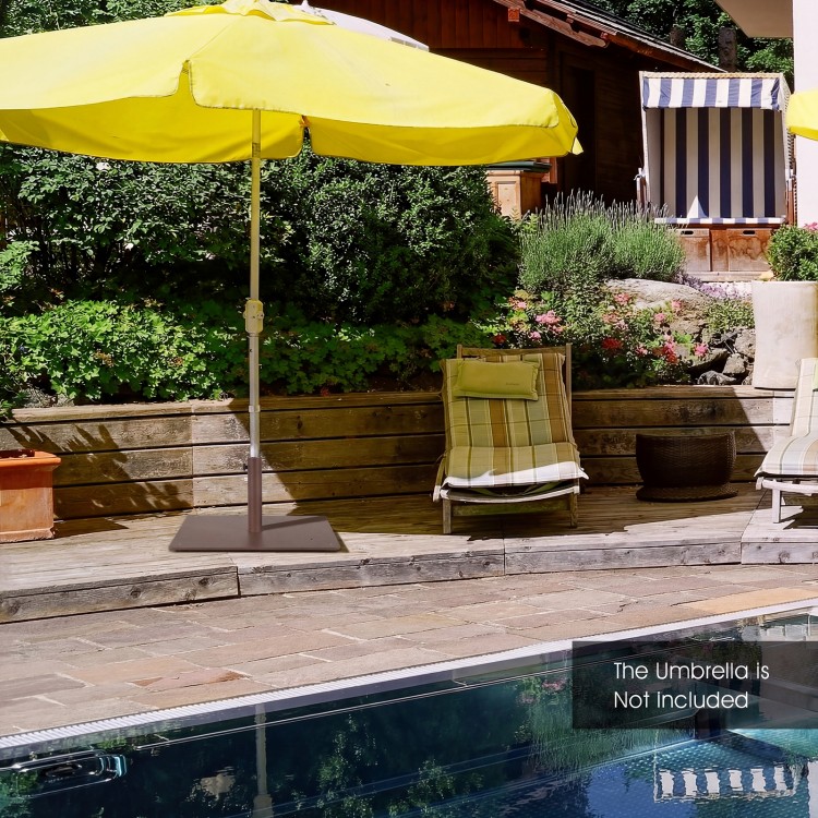 Patio umbrella base stand with adjustable footpads, durable powder-coated steel, ideal for stability on uneven ground.