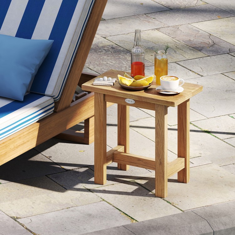 Teak shower stool with natural wood finish, ideal as a side table or for shaving legs in indoor or outdoor settings.