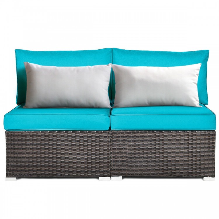 Armless patio rattan sofa set in blue with two cushions and pillows, perfect for outdoor relaxation.