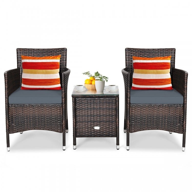 Gray cushioned rattan chair viewed from the side, showcasing its elegant design and ergonomic armrest for outdoor.