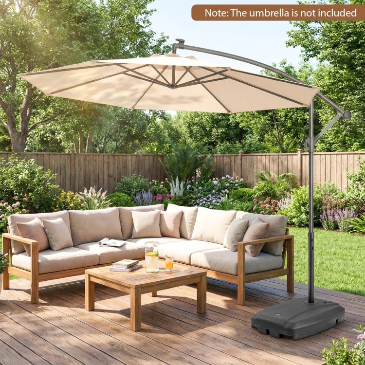 Cantilever patio umbrella base stand with wheels, fillable up to 220 lbs, made of durable HDPE for easy transport.