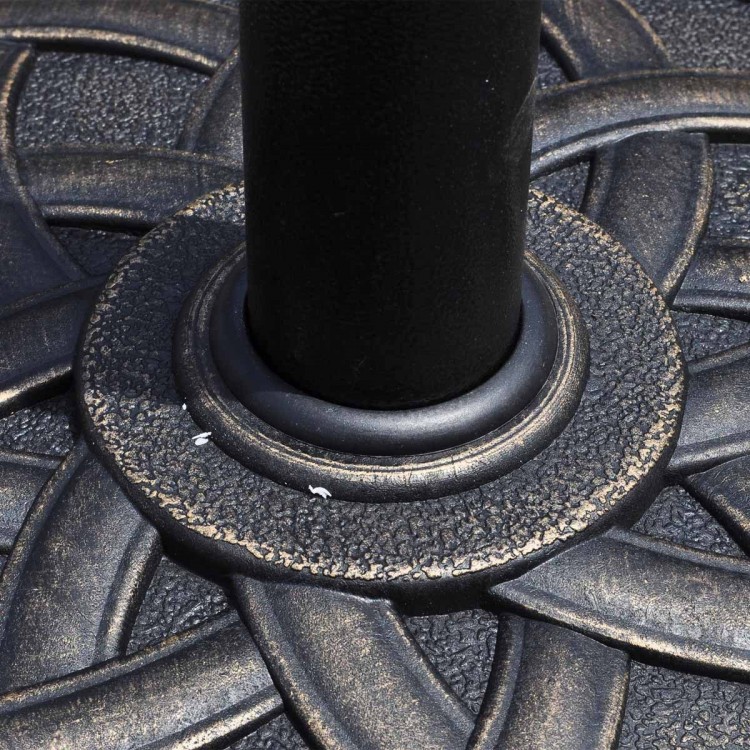 Close-up of the 22-inch heavy-duty round umbrella base stand with a decorative bronze finish and steel construction.