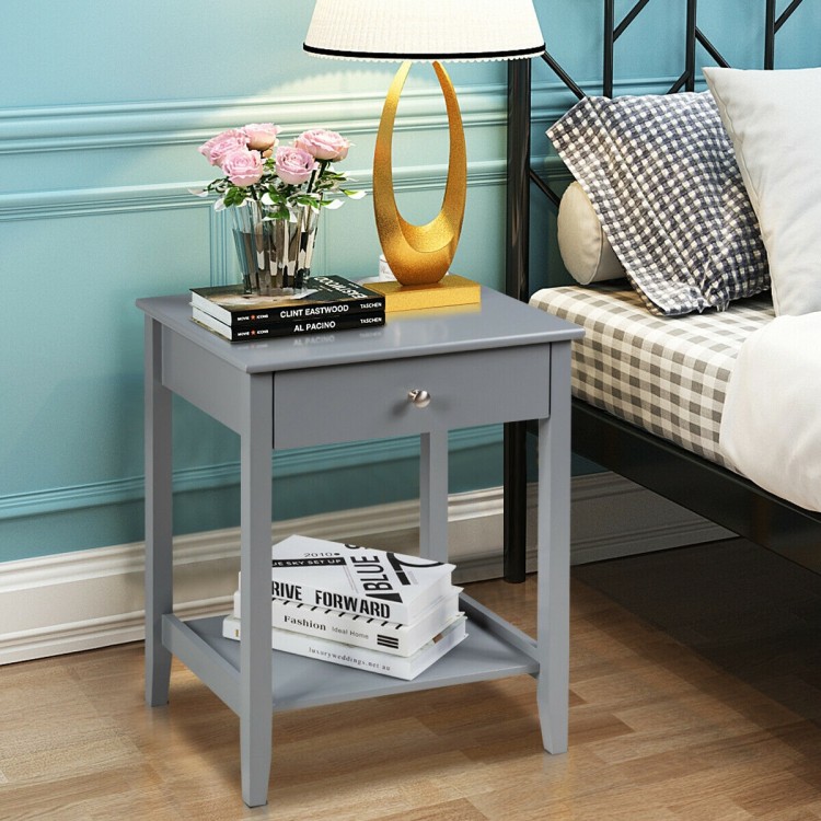 Gray wooden bedside table featuring a spacious tabletop, pull-out drawer, and open shelf for convenient storage.