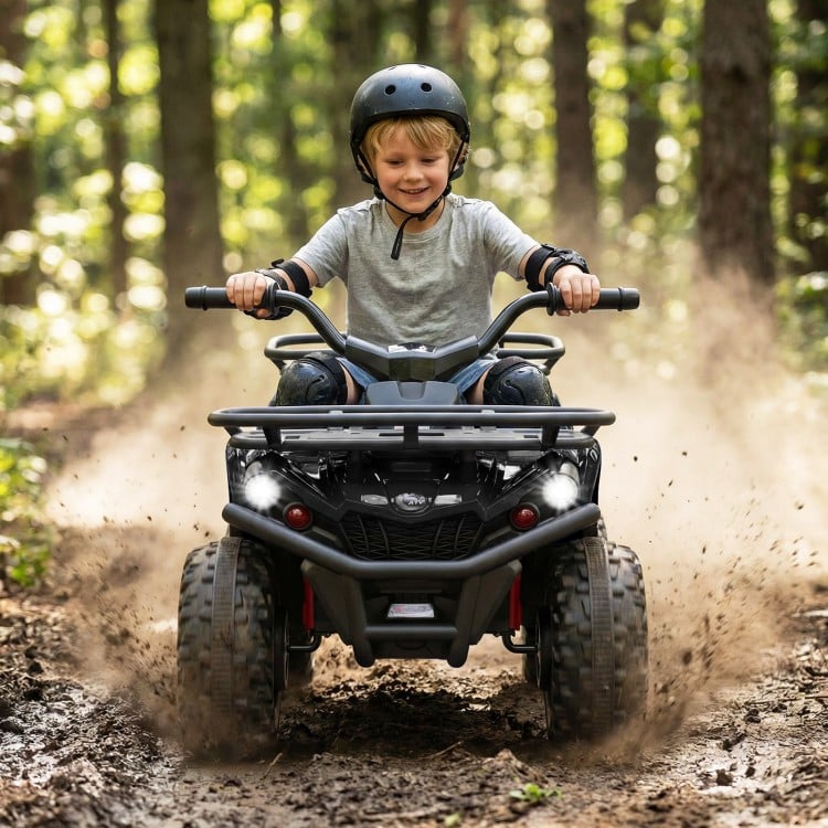 Child riding the 24V Electric Ride On Quad in black, featuring LED headlights and wear-resistant wheels for outdoor fun.