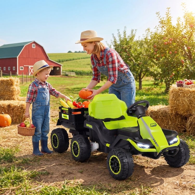 Green 24V ride-on tractor with detachable trailer, featuring a child and adult in a farm setting, perfect for outdoor.