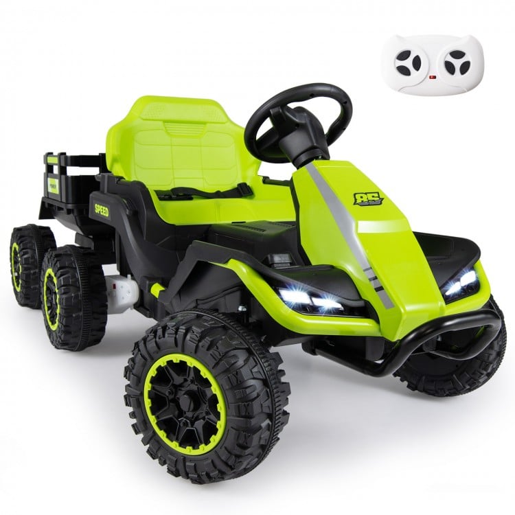 Green 24V ride-on tractor with detachable trailer, remote control, and LED headlights for kids' outdoor fun.