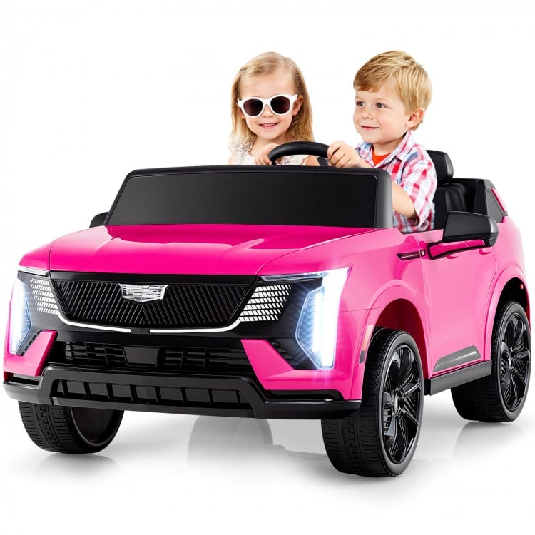 Two kids enjoying a pink 24V licensed Cadillac ride-on truck with remote control, featuring safety belts and.
