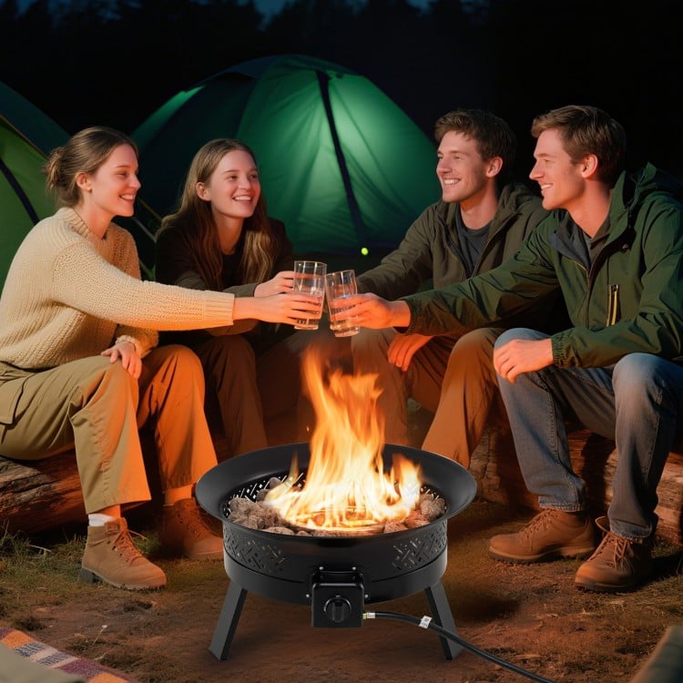 Portable 24.5-inch propane fire pit with folding legs and carry strap, perfect for outdoor gatherings and warmth.