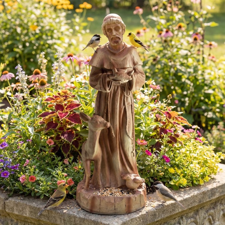 St. Francis statue with bird feeder, rustic brown finish, 24.5 inches tall, ideal for gardens and flowerbeds.