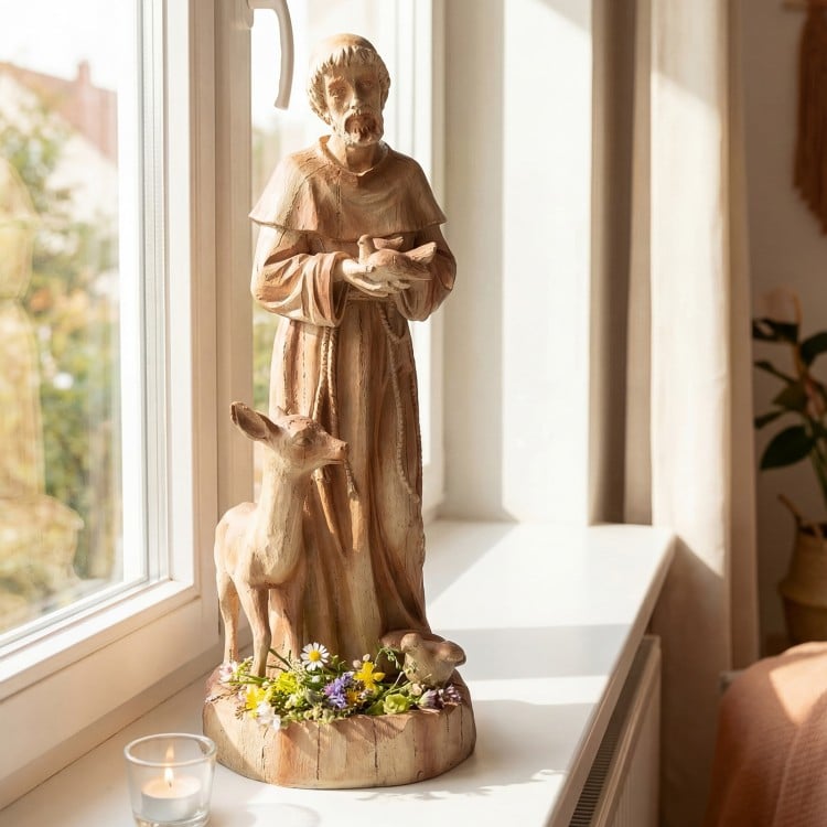 St. Francis statue with bird feeder, rustic brown, 24.5 inches tall, perfect for home or garden decoration.