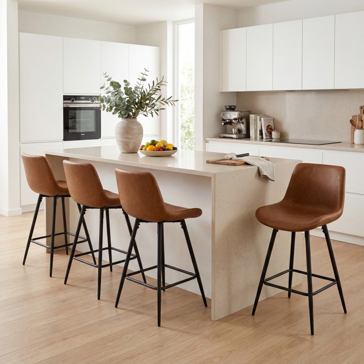 Set of two 24-inch brown bar stools with backs and footrests, featuring faux leather upholstery and sturdy metal legs.