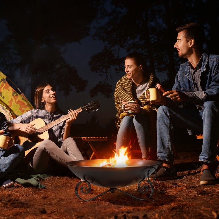 24-inch heavy-duty metal fire pit bowl with handles, perfect for cozy nights around the fire with friends outdoors.