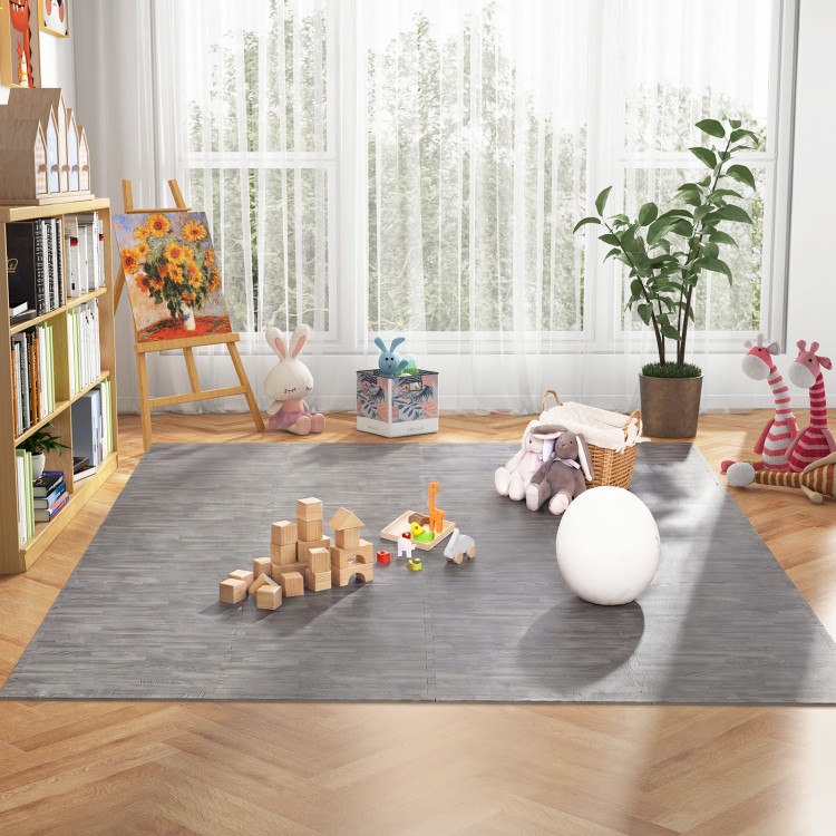 Gray wood grain foam floor mats arranged in a play area, ideal for children's activities and soft flooring.