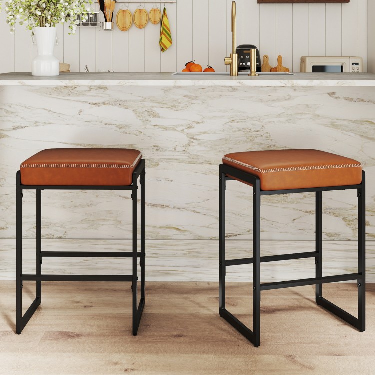 Set of 2 counter height bar stools with brown faux leather seats and sturdy metal frames, perfect for kitchen islands.