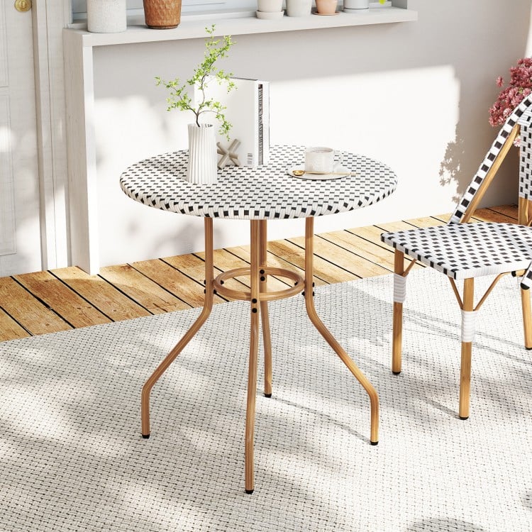 Round 27.5 inch outdoor bistro table with a heavy-duty metal frame and adjustable foot pads, perfect for patio use.