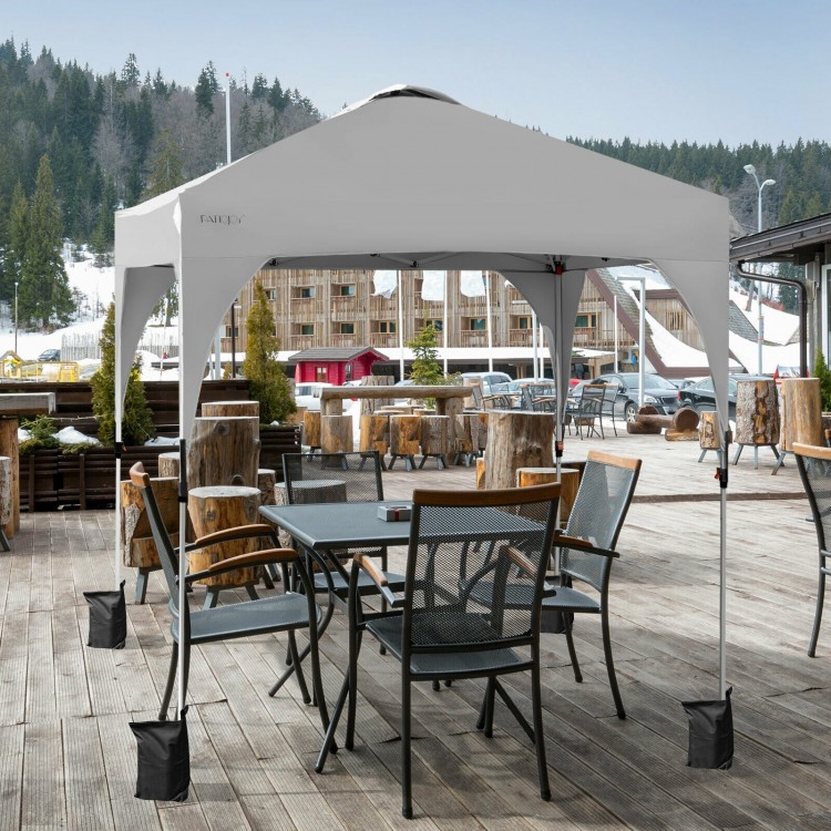 Height adjustable 6.6 x 6.6 FT white pop-up canopy tent with heavy-duty steel frame, ideal for outdoor shade and.