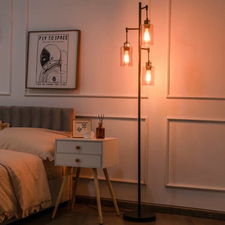 Retro floor lamp with three amber glass shades, stable iron base, perfect for bedroom or living room lighting.