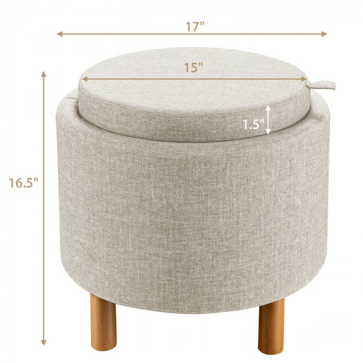 Round beige fabric storage ottoman with removable lid, wooden tray, and non-slip pads, ideal for bedroom use.