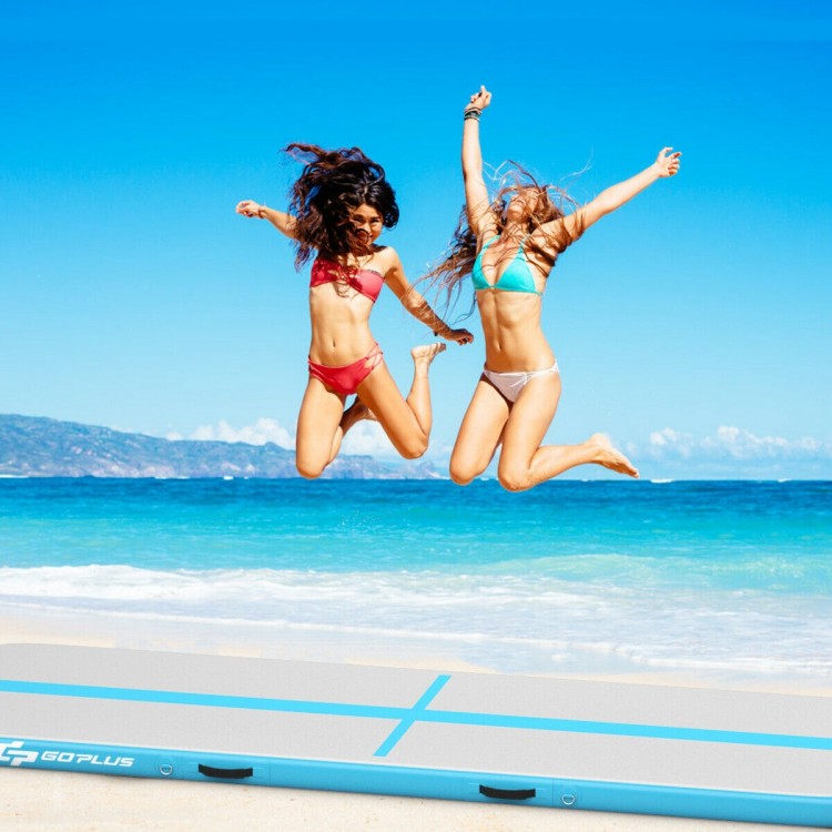 Two women jumping on a 15 feet inflatable gymnastics tumbling mat, perfect for exercise and water activities.