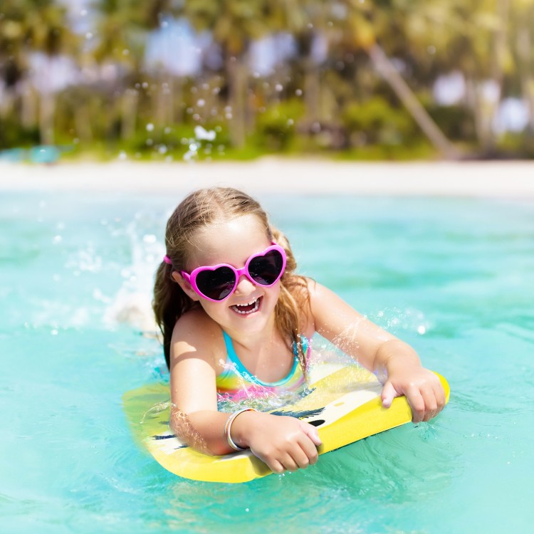 Child enjoying the Lightweight Bodyboard in the water, featuring a bright yellow design and strong buoyancy for summer.