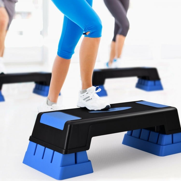 Aerobic exercise stepper trainer in blue with adjustable height, ideal for various workouts and ensuring safety during.