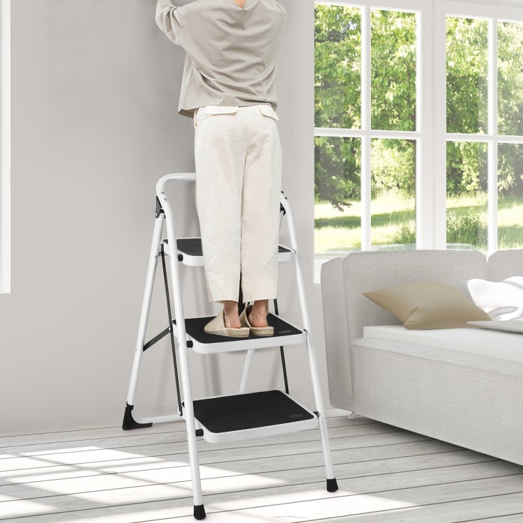 Folding 3-step ladder with handgrip and anti-slip platform, ideal for home or office use, shown in a bright room.
