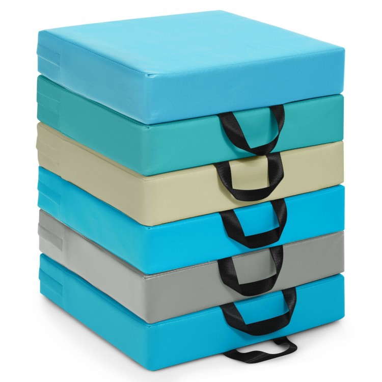 Stack of six colorful 15-inch square toddler floor cushions with handles, featuring waterproof covers and soft foam for.