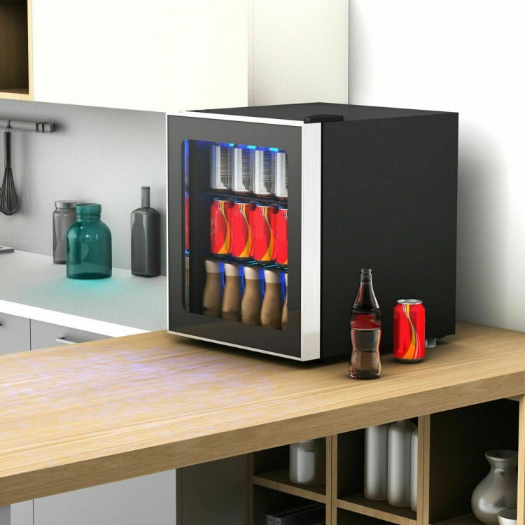 Mini beverage refrigerator with glass door, holding 60 cans, ideal for small kitchens or offices, featuring LED light.