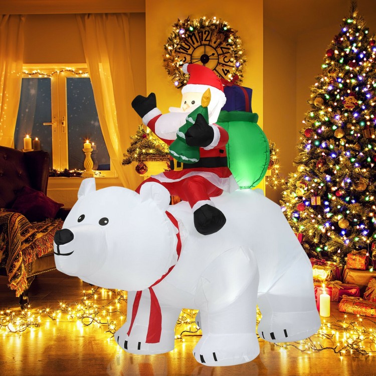 Christmas inflatable Santa riding a polar bear, 6.5 feet tall, with LED lights, perfect for festive yard decoration.