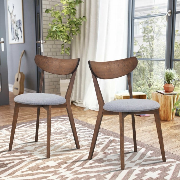Set of 2 dining chairs with upholstered curved backs and rubber wood legs, perfect for kitchen or dining room elegance.