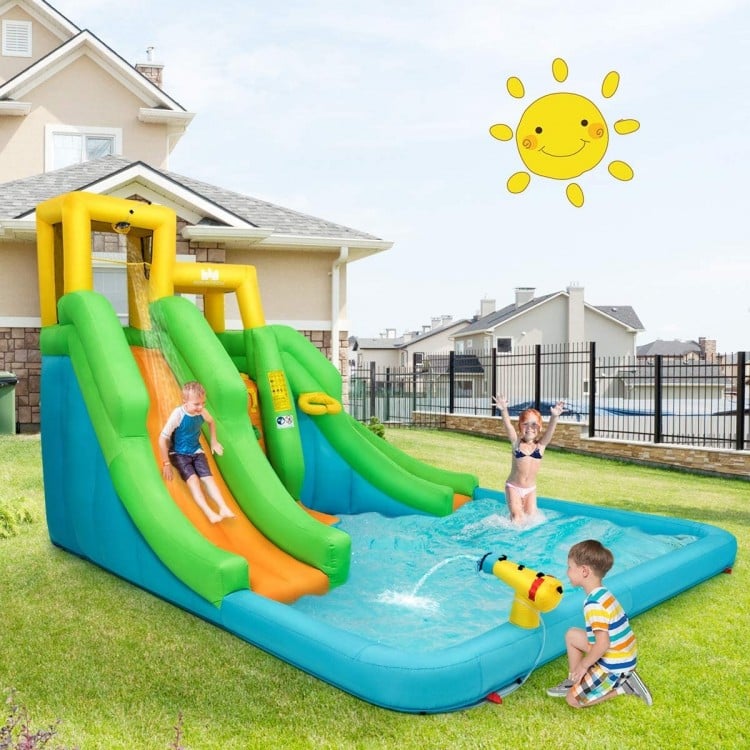 Inflatable Water Park Bounce House with climbing wall and water slide, perfect for outdoor fun in gardens or parks.