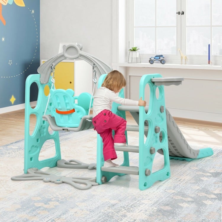 Toddler climbing frame with swing and slide in green, designed for safe play and motor skill development.